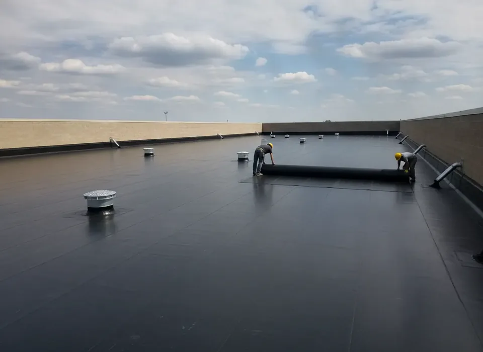 Black EPDM rubber membrane on a warehouse roof
